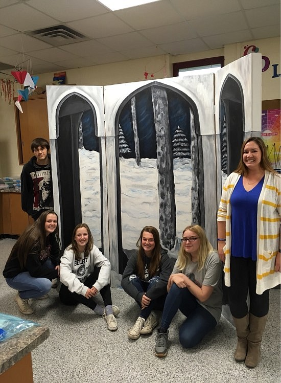 Elizabeth Sexton, Hauser visual arts teacher, with her husband, Jeremy, and her students, Carly Archer, Raley Clark, Shelby Fugate, Brooke Hopkins, Leah Joyce, Courtney Nicholas, Kayla Poff, Melanie Taylor, Tristan Watkins and Alex Woodson-Johnson, designed the backdrop of the IU Well House which will be center stage for the performance of the play "The Well House."