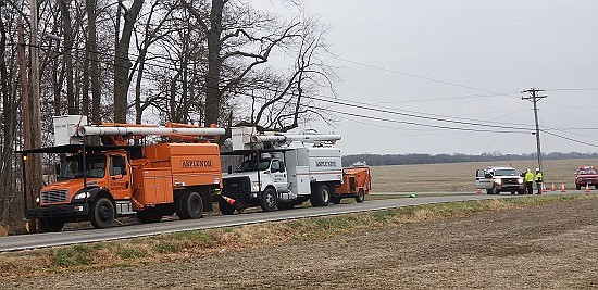 Tree trimmers for Bartholomew County REMC knocked down a tree Tuesday, Dec. 4th into power lines at County Road 500N and 1000E in Hope, creating a power outage that affected Schaefer Lake and other residents to the east. Photos courtesy of Michael Dean.