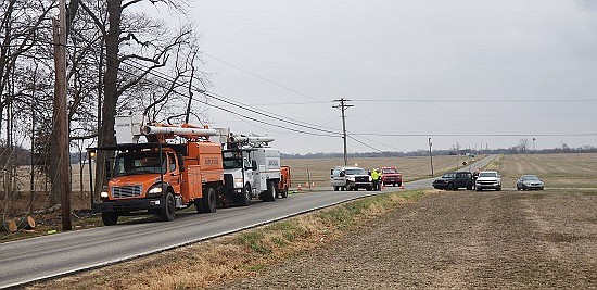 Tree trimmers for Bartholomew County REMC knocked down a tree Tuesday, Dec. 4th into power lines at County Road 500N and 1000E in Hope, creating a power outage that affected Schaefer Lake and other residents to the east. Photos courtesy of Michael Dean.