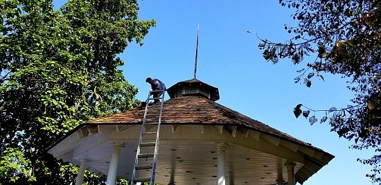 Amish Metal Roofers from Bloomington have been working to replace the roofs on the buildings on the Hope Town Square. Photos by Michael Dean.