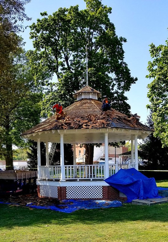 Amish Metal Roofers from Bloomington have been working to replace the roofs on the buildings on the Hope Town Square. Photos by Michael Dean.