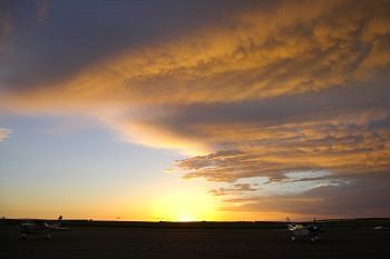 Sunrise from the airport somewhere in the Dakotas. June 7, 2004. Submitted by Mike Harding.