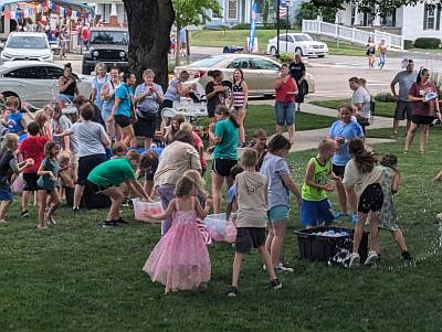 A water balloons helped the kiddos keep cool during the Old-Fashioned Independence Day celebration, hosted by the Yellow Trail Museum, on Friday, June 28, 2024, on the Hope Town Square in downtown Hope, Ind. Photo credit: Susan Thayer-Fye.