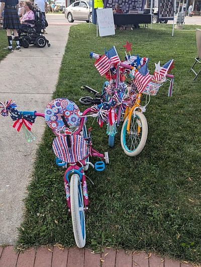 Bikes decorated for the bike parade as part of the festivities during the Old-Fashioned Independence Day celebration, hosted by the Yellow Trail Museum, on Friday evening, June 28, 2024, on the Hope Town Square in downtown Hope, Ind. Photo credit: Susan Thayer-Fye.
