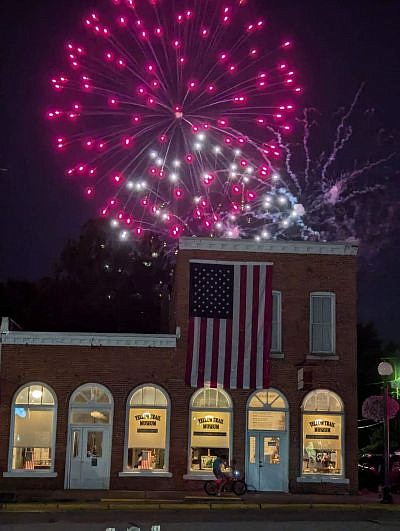 Fireworks over the Yellow Trail Museum during the return of Hope's Old-Fashioned Independence Day celebration, hosted by the Yellow Trail Museum, on Friday, June 28, 2024, in downtown Hope, Ind. Photo credit: Susan Thayer-Fye.