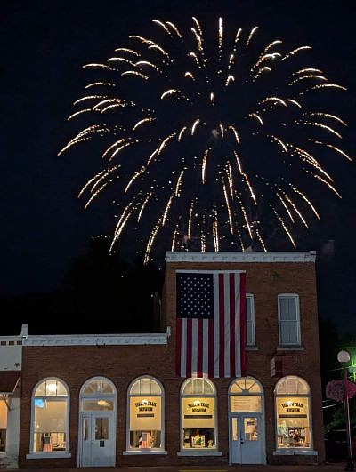 Fireworks over the Yellow Trail Museum during the return of Hope's Old-Fashioned Independence Day celebration, hosted by the Yellow Trail Museum, on Friday, June 28, 2024, in downtown Hope, Ind. Photo credit: Susan Thayer-Fye.