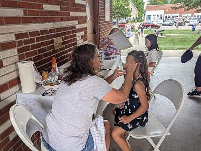 Face painting was just one of several activities for the kiddos during the return of Hope's Old-Fashioned Independence Day celebration, hosted by the Yellow Trail Museum, on Friday, June 28, 2024, on the Hope Town Square in downtown Hope. Photo credit: Susan Thayer-Fye.