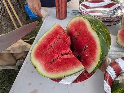 Delicious watermelon served during the festivities on the Hope Town Square during Hope's Old-Fashioned Independence Day celebration, hosted by the Yellow Trail Museum, Friday, June 28, 2024, in downtown Hope, Ind. Photo credit: Susan Thayer-Fye.
