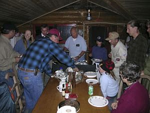 Dave Shields, my friend from McMillan & Company, hosted us for a wild game dinner at his cabin south of Great Falls, MT. Trout, grouse thighs, quail, venison chili, and elk ribs. June 9, 2004. Photo credit: Mike Harding, submitted.