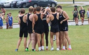 The varsity boys team gets ready to run at the Rushville Cross Country Classic. August 2024. Photo credit: Ben Finke, submitted.
