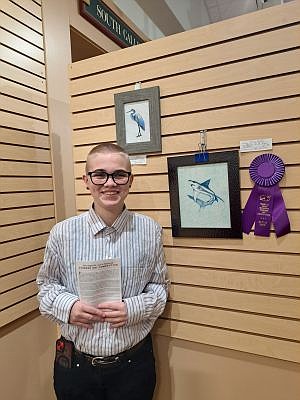 Congratulations are in order for Hauser student Erica Harker who recently won Best in Show during an awards ceremony at the Mabel B. Annis Brown County Student Art Competition on Sunday, March 9 at the Brown County Art Gallery in Nashville, Ind. Erica poses with her award-winning artwork. Photo credit: Submitted courtesy of Elizabeth Sexton.