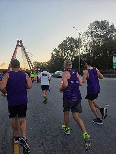Todd Grimes (center) running in the Mill Race 5K with his brother and nephew. Photo credit: Todd Grimes, submitted.