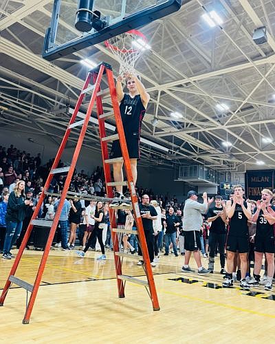 Hauser's Stryker Gill cuts the net following the team's win at Saturday's away game against Milan. March 9, 2026. Photo credit: Greg Turner