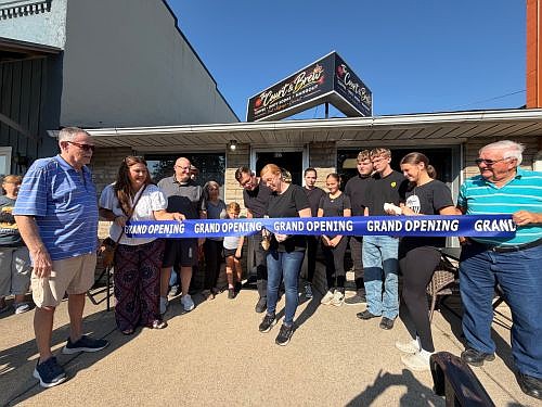 Owners Adam and Christina Bain (center) cut the ribbon at the Grand Opening of Court & Brew, located at 622 Main St. in downtown Hope, Ind., on Friday, September 4, 2026. 
Photo credit: Diane Burton